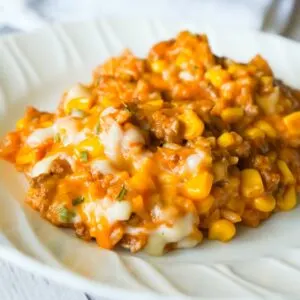 One Pot Mexican Ground Beef and Rice is a stove top dinner recipe loaded with ground beef, rice, salsa, corn and cheese. This cheesy ground beef and rice casserole is an easy dinner recipe perfect for weeknights.