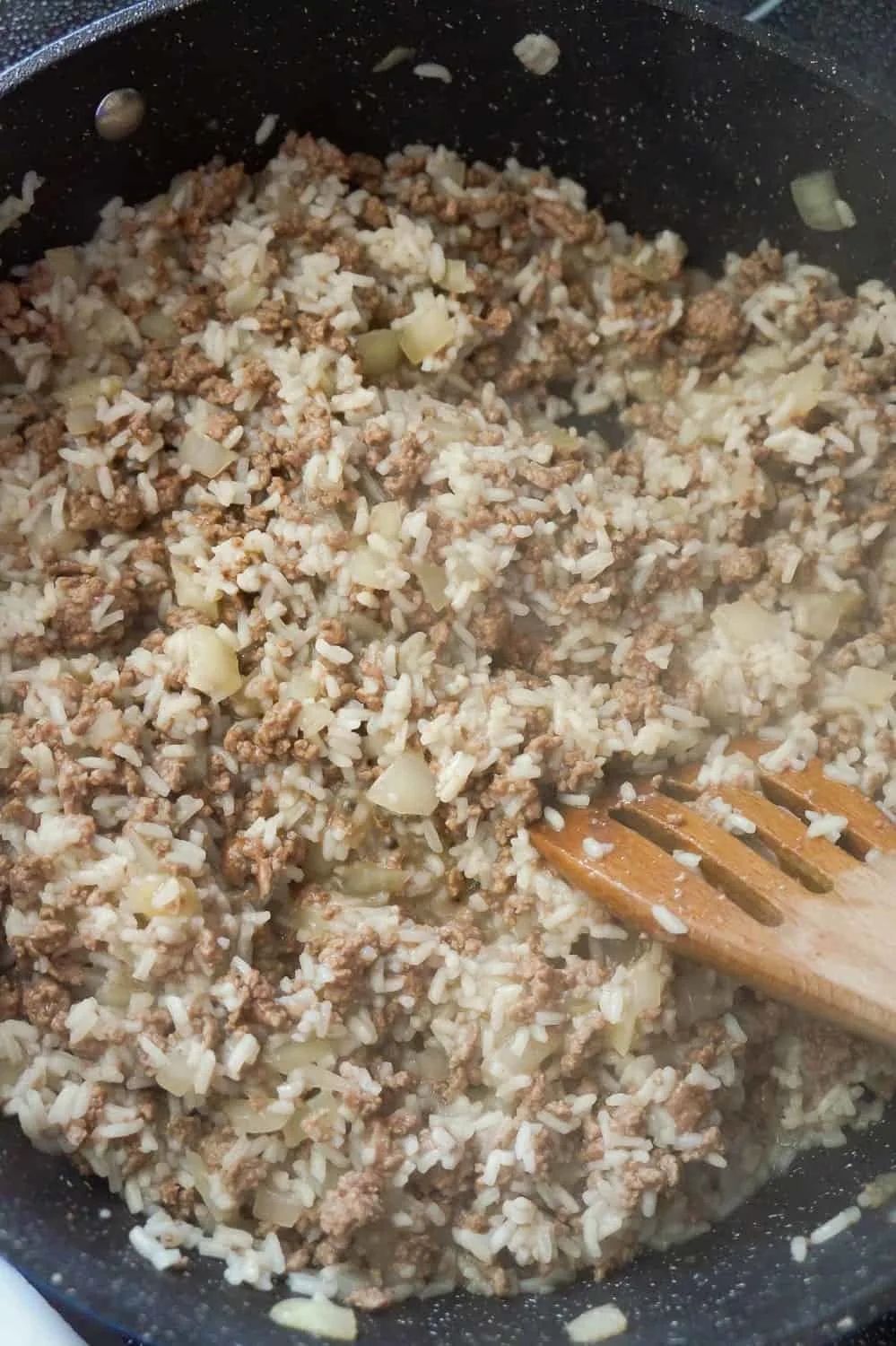 ground beef and rice in a skillet