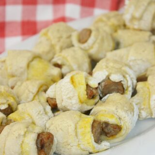 Gluten Free Pigs In A Blanket is an easy and delicious recipe.  Whip up a batch of Gluten Free Crescent Rolls and you are ready to wrap up some gluten free sausage to create this popular appetizer.