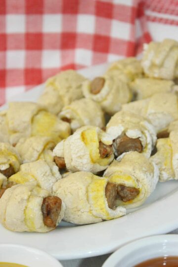 Gluten Free Pigs In A Blanket is an easy and delicious recipe. Whip up a batch of Gluten Free Crescent Rolls and you are ready to wrap up some gluten free sausage to create this popular appetizer.
