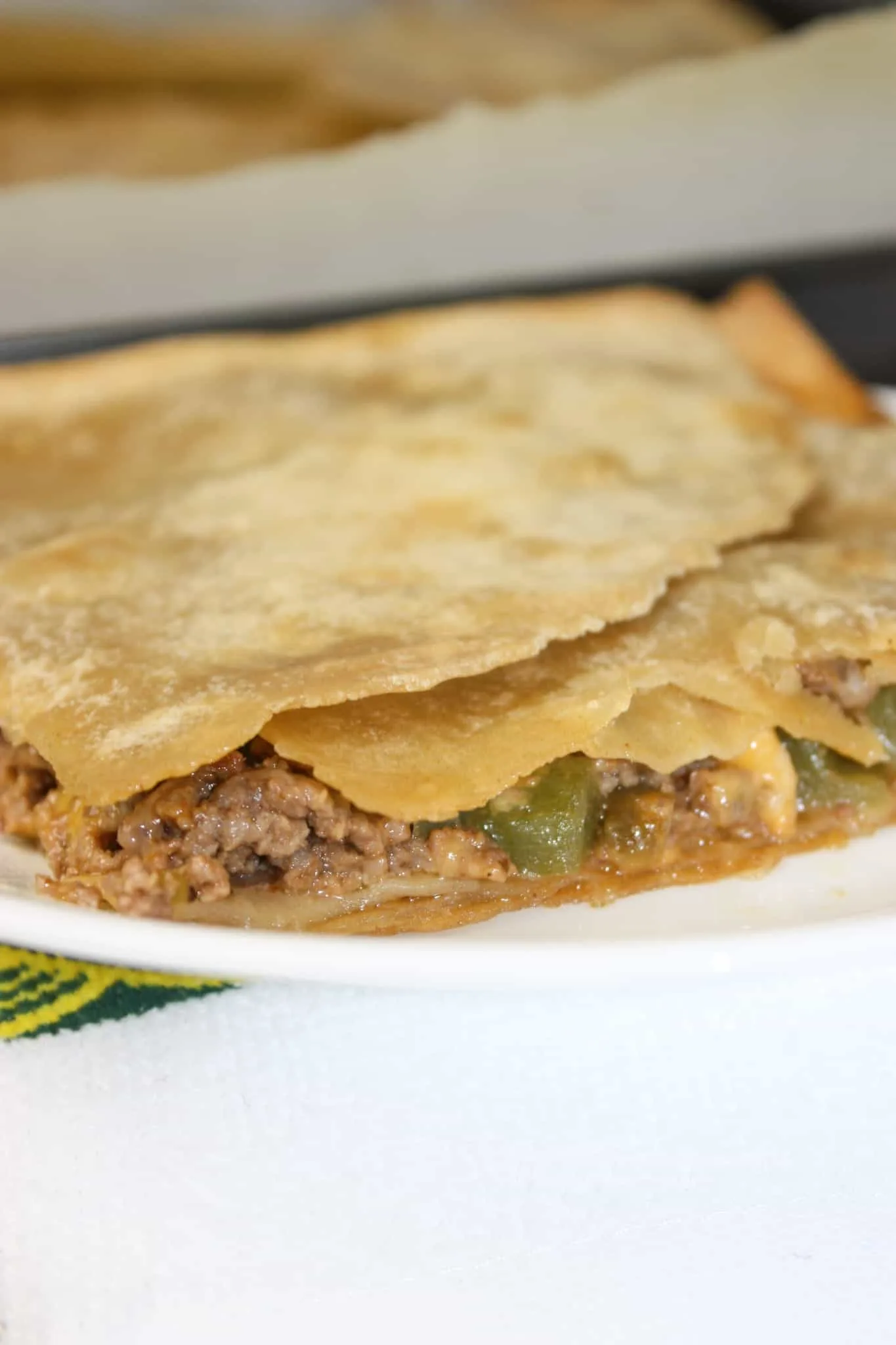 Ground Beef Quesadilla Casserole is an easy way to make quesadillas for the whole family.  This casserole recipe is loaded with flavour and is also a recipe that you can easily modify to suit your tastes.