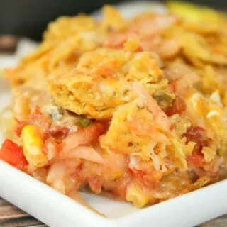 Mexican Potato Casserole is an easy side dish that is sure to be a hit with young and old alike!   The crispy topping is the perfect complement to the cheesy, potato base.
