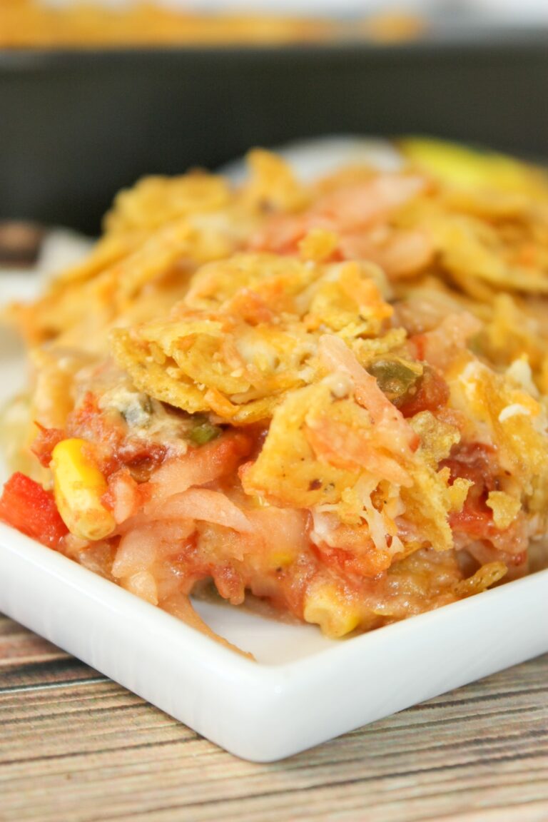 Mexican Potato Casserole is an easy side dish that is sure to be a hit with young and old alike!   The crispy topping is the perfect complement to the cheesy, potato base.