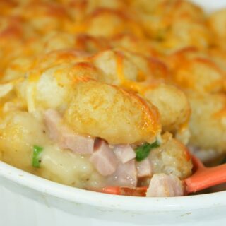 Tater Tot Casserole with Ham is an easy dinner recipe that is loaded with crunchy tater tots and cooked ham.  The gluten free condensed cream of chicken soup not only adds moisture but flavour as well.