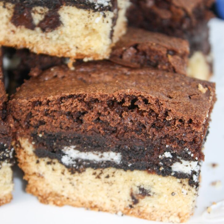 Gluten Free Slutty Brownies are delicious triple layer brownies with a chocolate chip cookie base, Oreo middle and chocolate brownie batter on top.