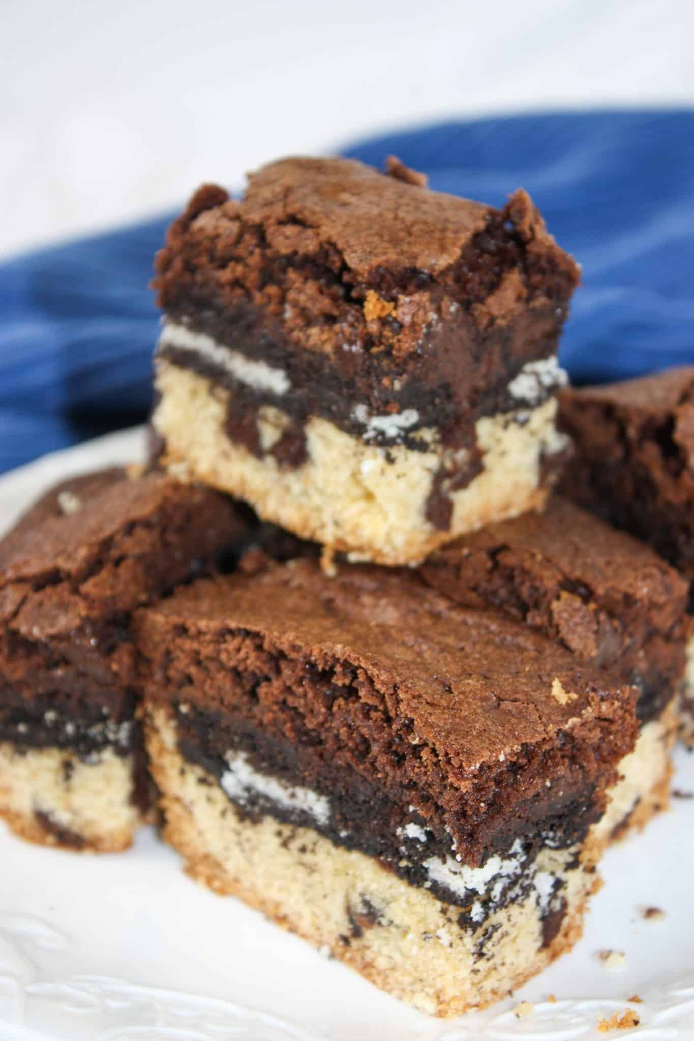 Gluten Free Slutty Brownies are delicious triple layer brownies with a chocolate chip cookie base, Oreo middle and chocolate brownie batter on top.
