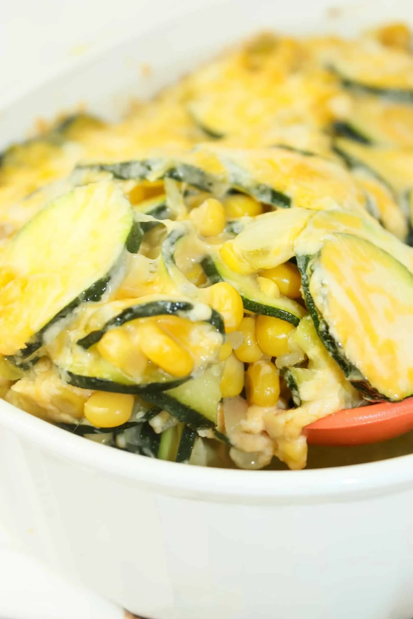 Mexican Squash Casserole is a quick side dish that can easily be whipped up on a busy week night.  This gluten free recipe is loaded with corn and topped with a flavourful cheese blend.
