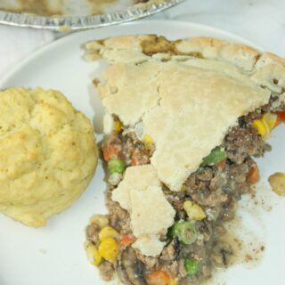 Stroganoff Pot Pie is a delicious dinner recipe filled with ground beef, vegetables and seasonings.  Gluten Free condensed mushroom soup creates a flavourful sauce to complement the other ingredients.