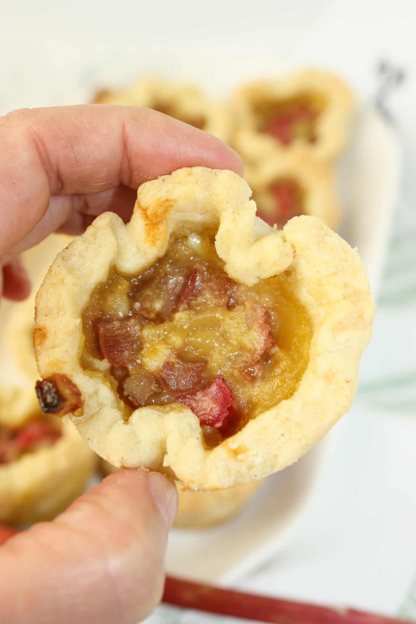 Rhubarb Butter Tarts are a delicious variation of the classic Canadian butter tart. These tarts combine the sweet, gooey filling of traditional butter tarts with the tangy flavor of rhubarb.  