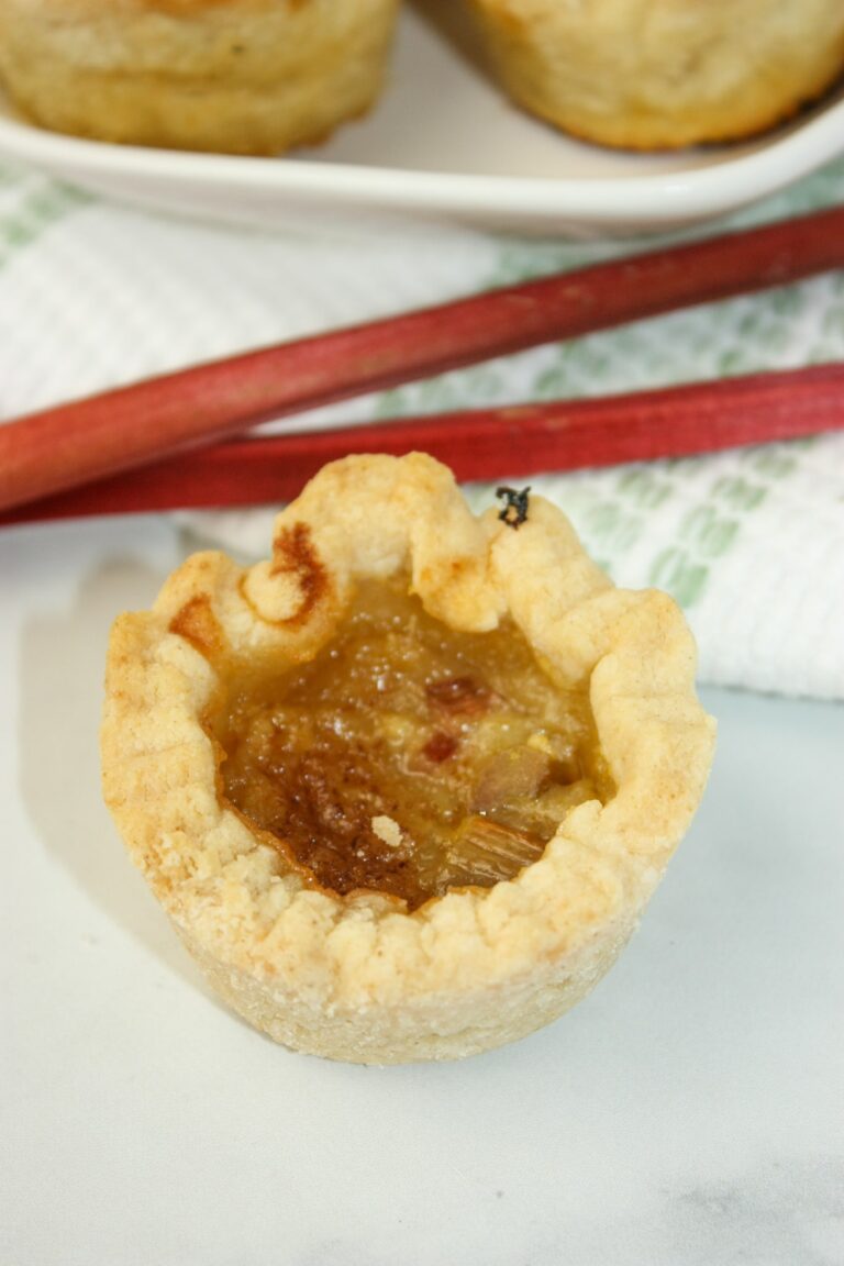 Rhubarb Butter Tarts are a delicious variation of the classic Canadian butter tart. These tarts combine the sweet, gooey filling of traditional butter tarts with the tangy flavor of rhubarb.  