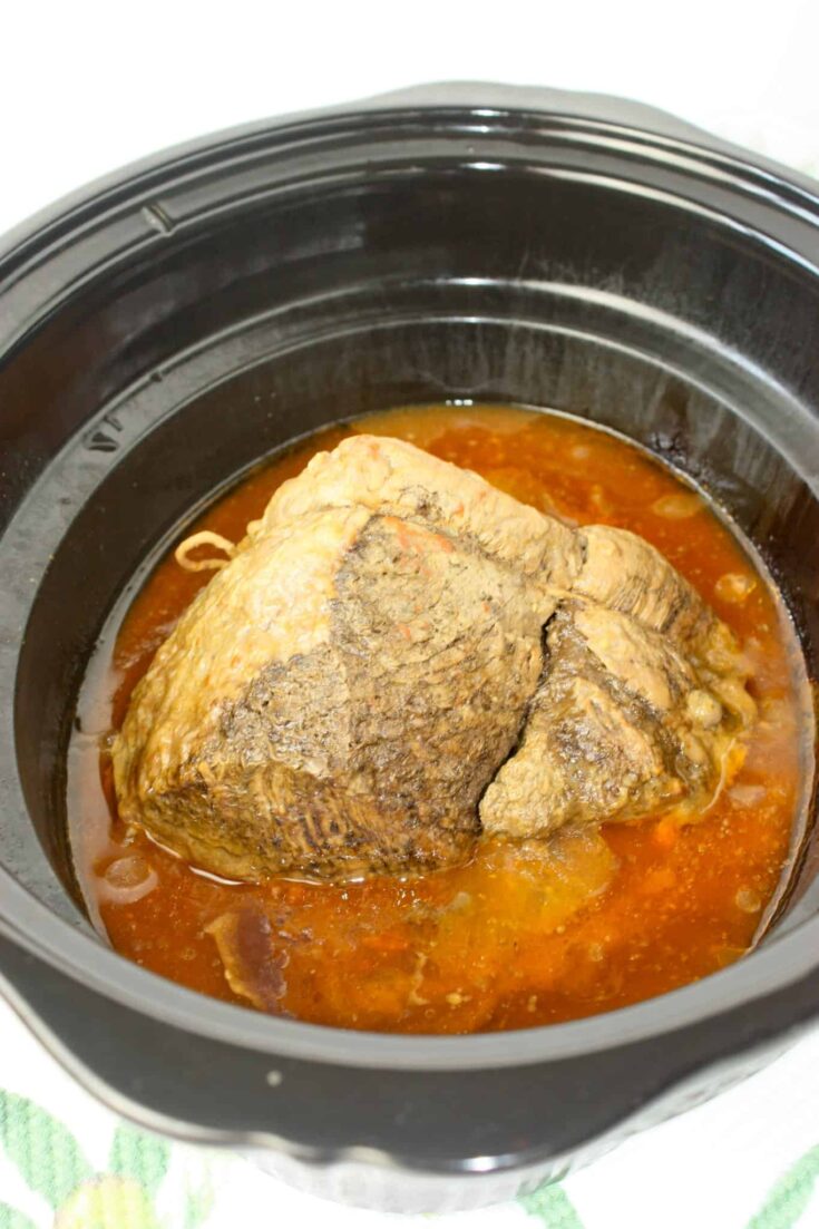 Crock Pot Spicy Pot Roast is a flavorful and tender dish made by slow-cooking a beef roast with a blend of seasonings and liquid over several hours.