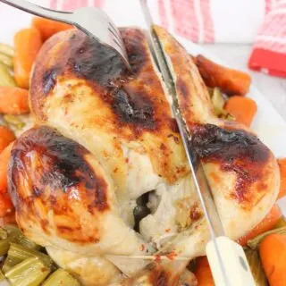 Easy Roast Chicken is bathed in Italian dressing and roasted to perfection. The skin is slightly charred and glistening, covered with a blend of herbs, garlic, and spices from the dressing that has caramelized during roasting.