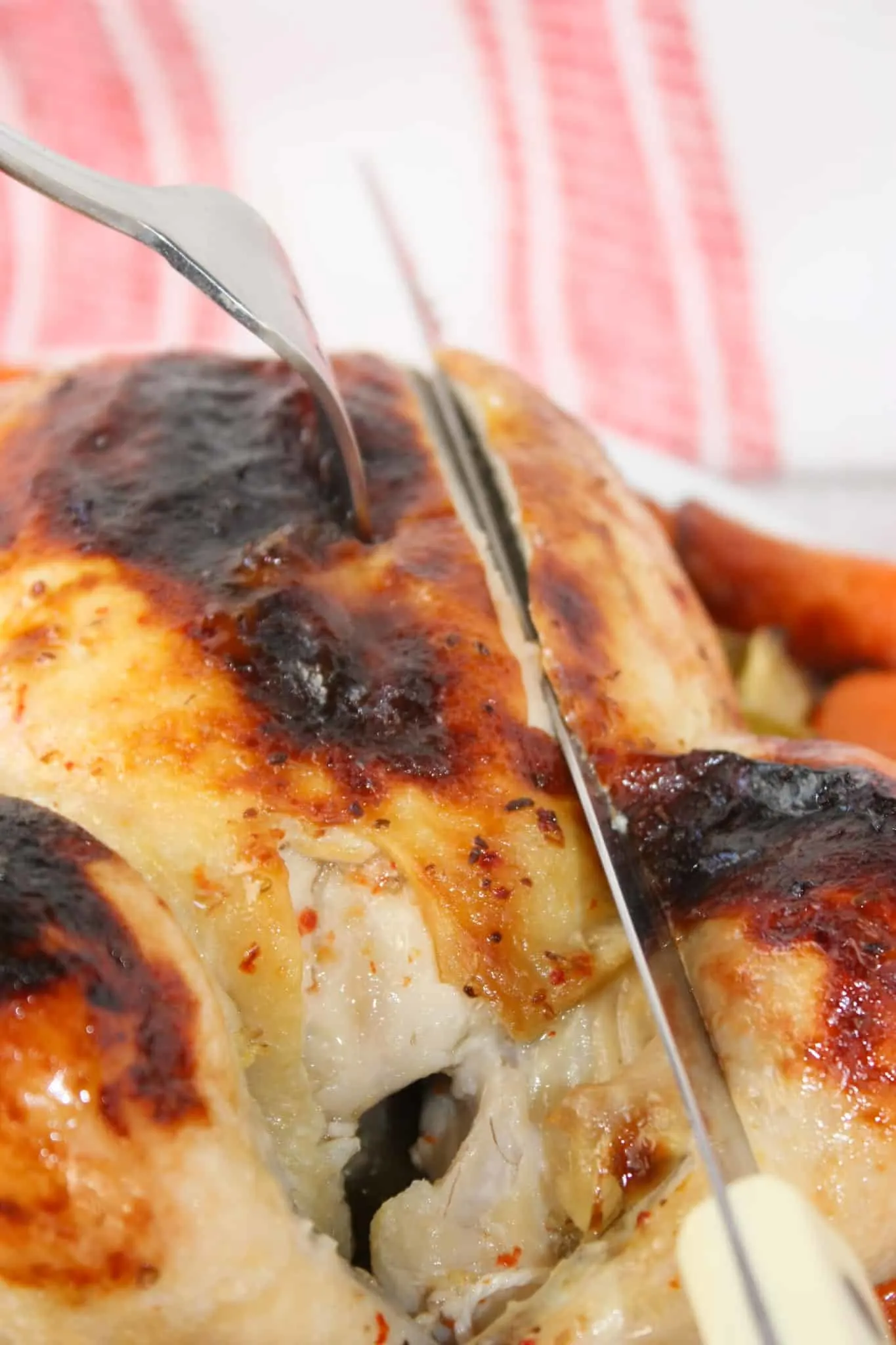 Easy Roast Chicken is bathed in Italian dressing and roasted to perfection. The skin is slightly charred and glistening, covered with a blend of herbs, garlic, and spices from the dressing that has caramelized during roasting.