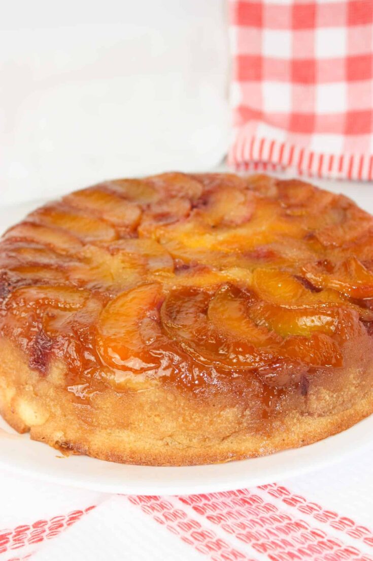 Peach Raspberry Upside Down Cake is a visually stunning dessert featuring a juicy, caramelized fruit topping over a soft, tender cake.