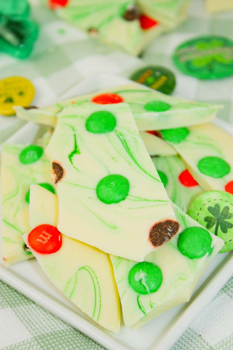 St. Patrick’s Day Bark is a festive and colorful treat made with a smooth base of white chocolate, swirled with vibrant green food coloring for a marbled effect.