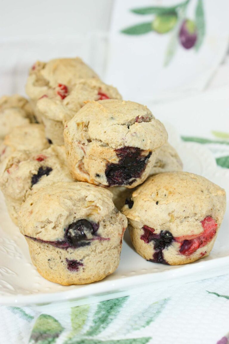 Gluten Free Fruit Muffins are bursting with juicy blueberries, tangy rhubarb, and sweet strawberries in every bite.