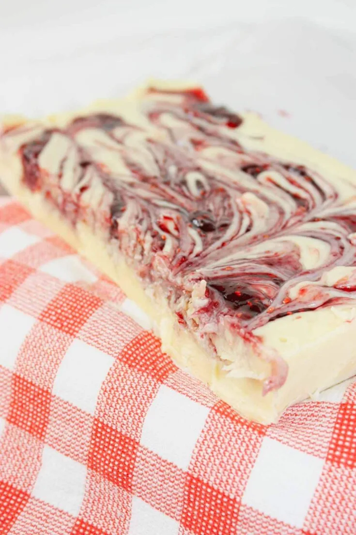Microwave Raspberry Fudge is a creamy, dreamy treat that’s as easy as it is indulgent. Made with smooth white chocolate and sweetened condensed milk, it melts into a rich, velvety base in just minutes.