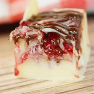 Microwave Raspberry Fudge is a creamy, dreamy treat that’s as easy as it is indulgent. Made with smooth white chocolate and sweetened condensed milk, it melts into a rich, velvety base in just minutes.