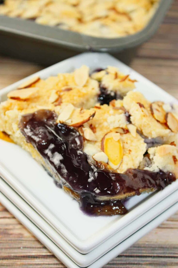 Blueberry Peach Dump Cake is bursting with juicy fruit flavour in every bite. Sweet peaches and plump blueberries mingle together under a golden, buttery cake topping. 