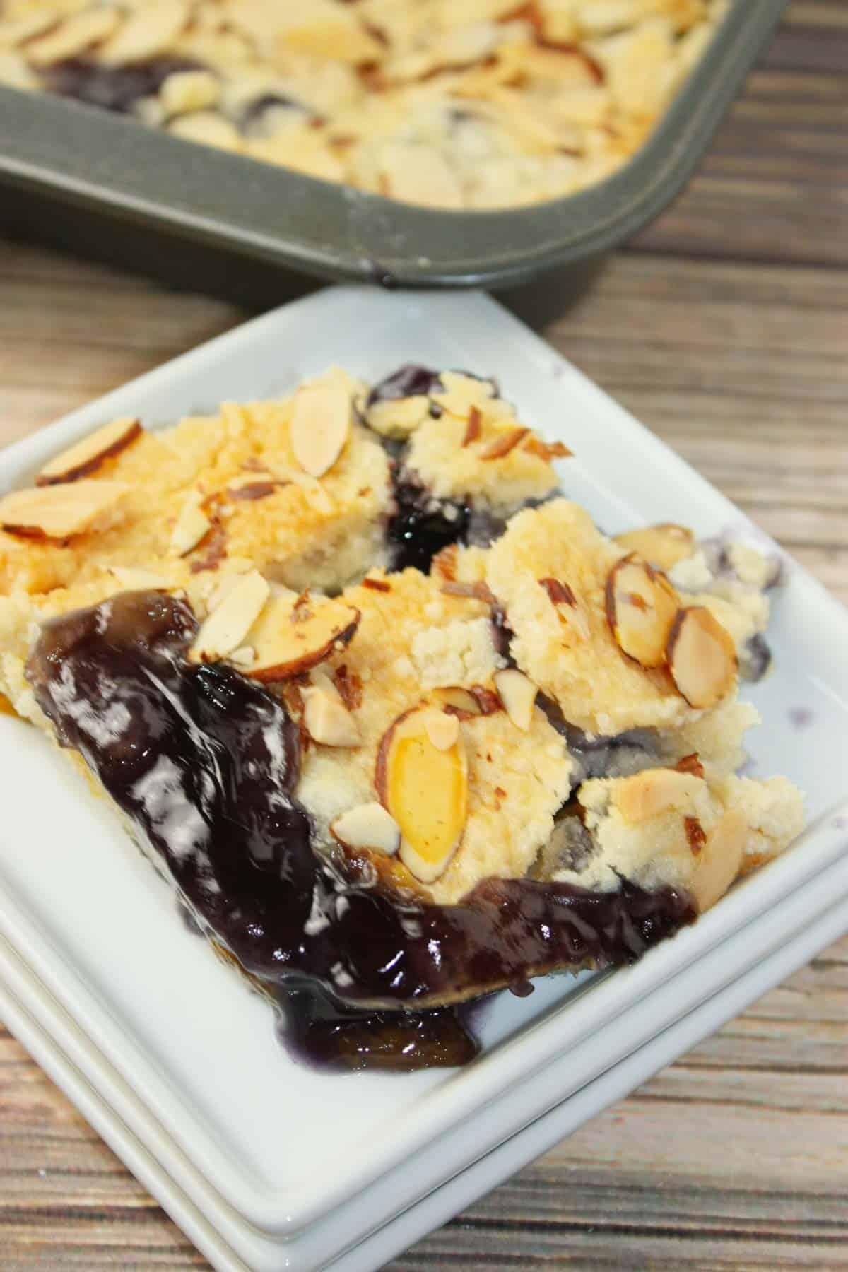 Blueberry Peach Dump Cake is bursting with juicy fruit flavour in every bite. Sweet peaches and plump blueberries mingle together under a golden, buttery cake topping.