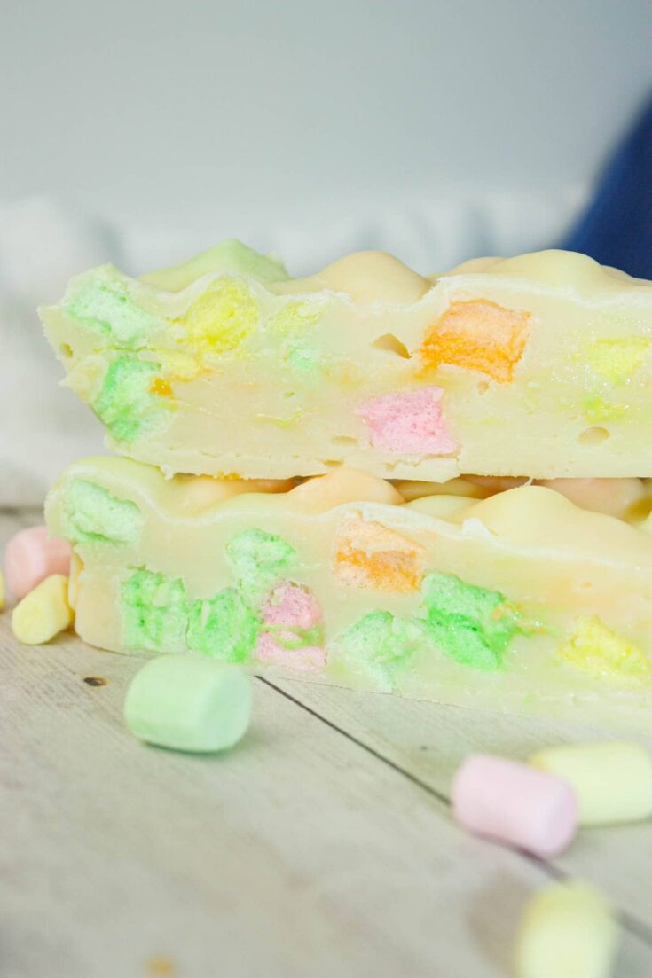 This Microwave Rainbow Fudge swirls with playful pops of fruity colour in every bite.  The fruity mini marshmallows peek through the creamy base like tiny gems.