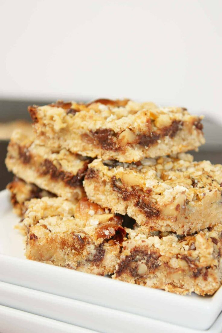 These Gluten Free Oat Bars are rich, chewy, and packed with chocolatey goodness in every bite.