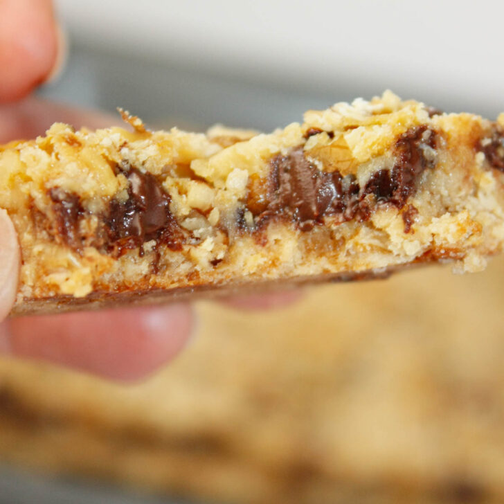 These Gluten Free Oat Bars are rich, chewy, and packed with chocolatey goodness in every bite.