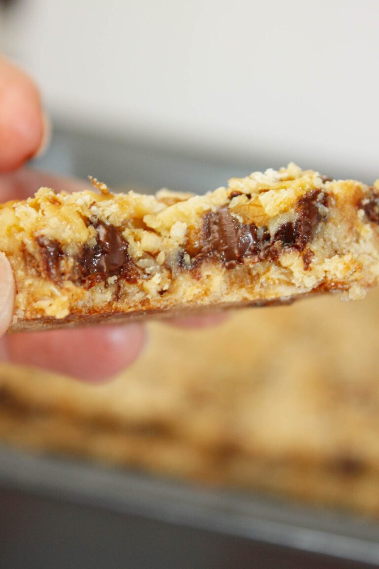 These Gluten Free Oat Bars are rich, chewy, and packed with chocolatey goodness in every bite.